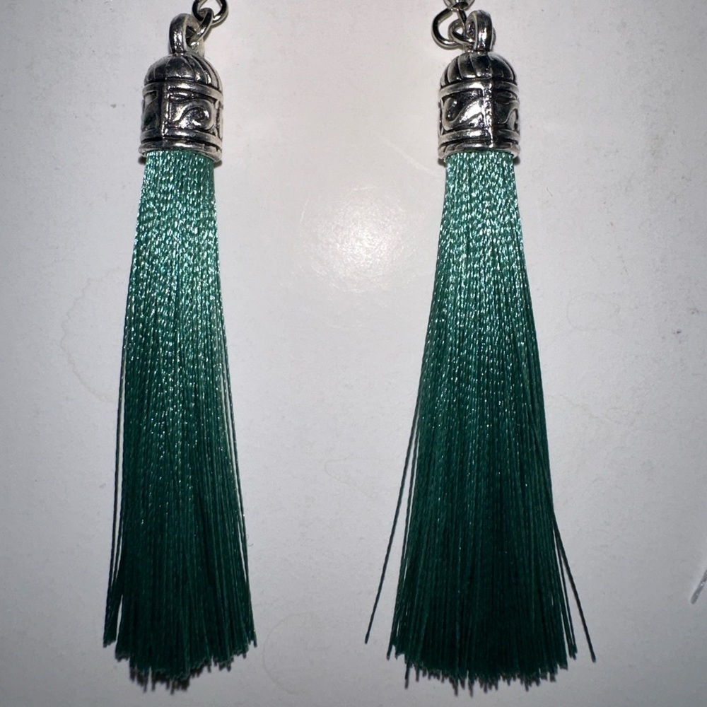 Light faded green tassel earrings